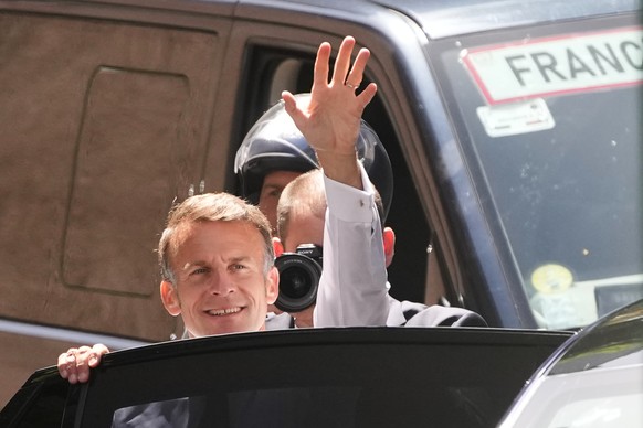 French President Emmanuel Macron waves as he arrives to meet security forces ahead of G7 summit in Evian-les-Bains, France, Monday, June 15, 2026. (AP Photo/Christophe Ena)
France G7 Summit