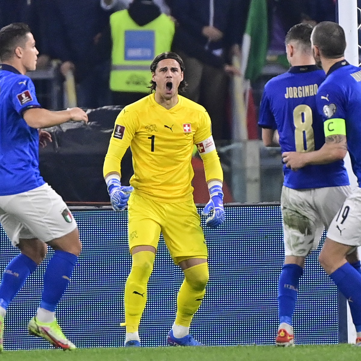 Italy's midfielder Jorge Luiz Frello Filho "Jorginho", center in blue, reacts after missing a penalty in front of Switzerland's goalkeeper Yann Sommer, second from left, during the ...