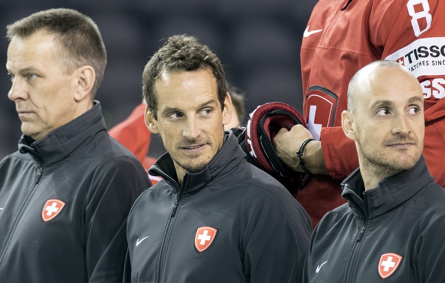 Switzerland&#039;s Tommy Albelin, assistant coach, Patrick Fischer, head coach and Christian Wohlwend, assistant coach, from left, pose during a photo session before a training session during the Ice  ...