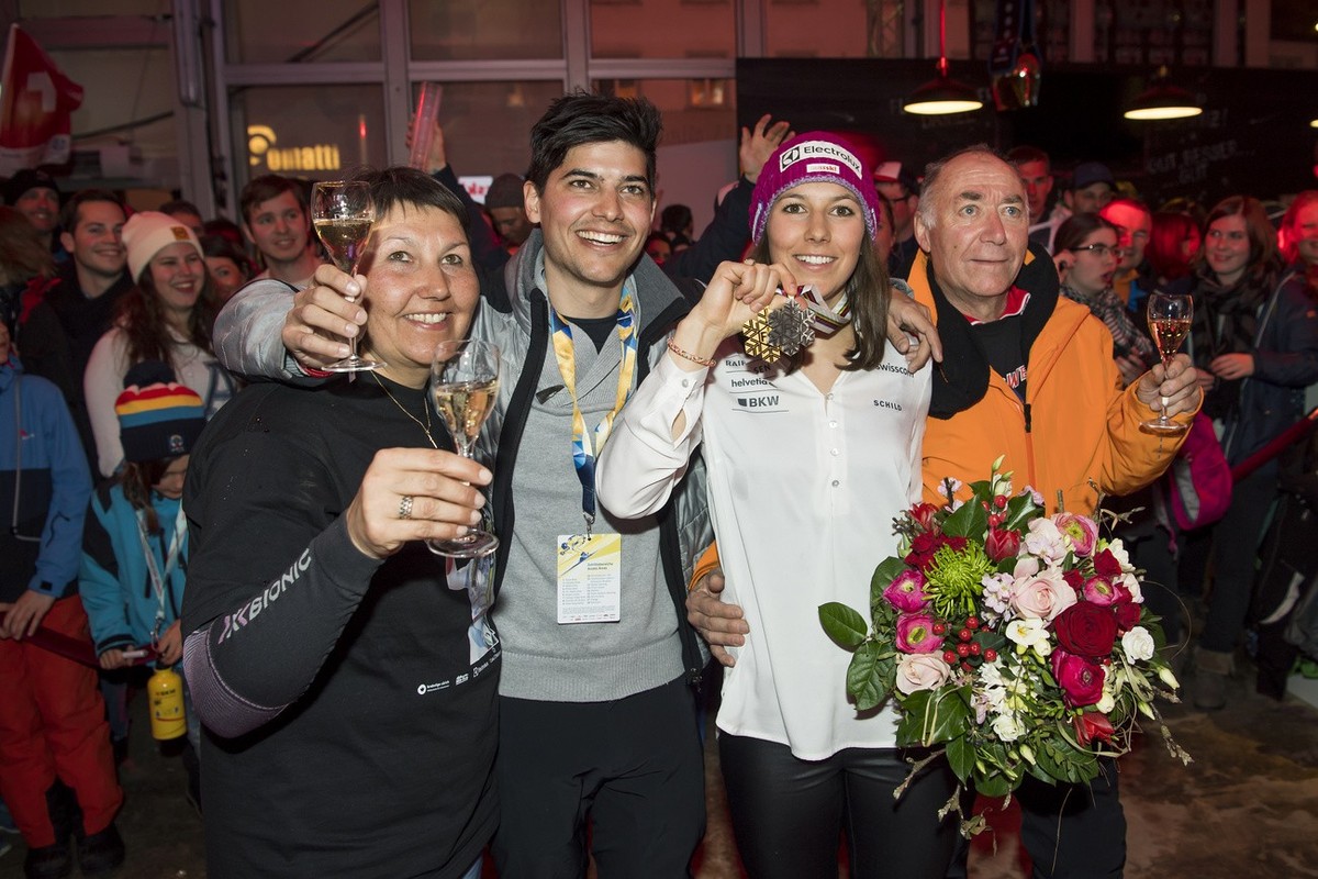 Silver medalist Wendy Holdener of Switzerland, 3rd from left, poses with her mother Daniela, brother Kevin, and father Martin from left to right, as they celebrate at the "House of fans" aft ...
