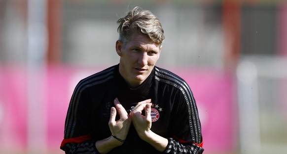 Bayern&#039;s Bastian Schweinsteiger gestures during a training session prior to the Champions League quarterfinal second leg soccer match between FC Bayern Munich and FC Porto at Allianz Arena in Mun ...