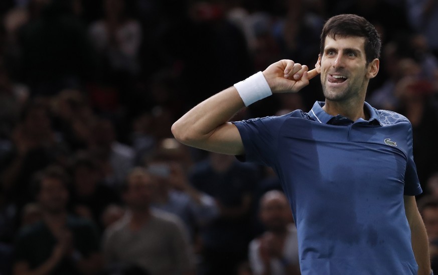 epa07139626 Novak Djokovic of Serbia celebrates winning his semifinal match against Roger Federer of Switzerland at the Rolex Paris Masters tennis tournament in Paris, France, 03 November 2018. EPA/CH ...