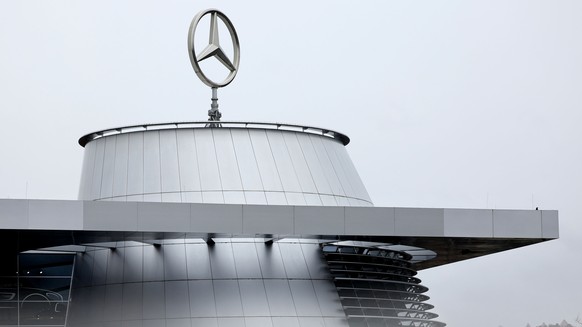 epa11172233 The Mercedes logo pictured atop the headquarters of Mercedes-Benz AG, in Stuttgart, Germany, 22 February 2024. The Mercedes-Benz Group holds their annual press conference on 22 February 20 ...