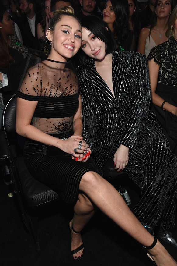 LOS ANGELES, CA - FEBRUARY 10: Miley Cyrus (L) and Noah Cyrus during the 61st Annual GRAMMY Awards at Staples Center on February 10, 2019 in Los Angeles, California. (Photo by Kevin Mazur/Getty Images ...