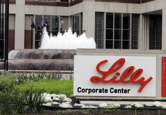 FILE- In this April 26, 2017, file photo shows the Eli Lilly and Co. corporate headquarters in Indianapolis. Eli LillyÄôs new COVID-19 treatment helped the drugmakerÄôs fourth-quarter profit surge e ...