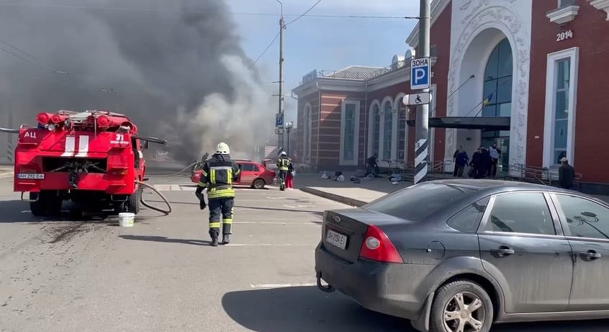 epa09878018 A handout picture made available by the Donetsk Regional State Administration shows emergency services working at the scene after a missile strike hit the railway station in Kramatorsk, Do ...