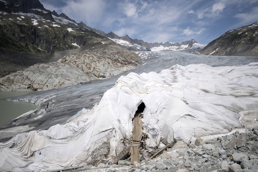 epa06047656 A general view over the Rhone Glacier covered in blankets above Gletsch near the Furkapass, Switzerland, 24 June 2017. The Alps oldest glacier is protected by special white blankets to pre ...