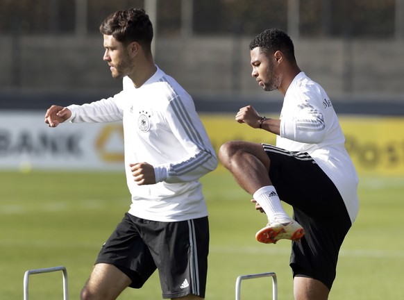 Jonas Hector, left, and Serge Gnabry, right, practice during a training session of the German national soccer team in Berlin, Germany, Wednesday, Oct. 10, 2018. Germany will face the team of the Nethe ...