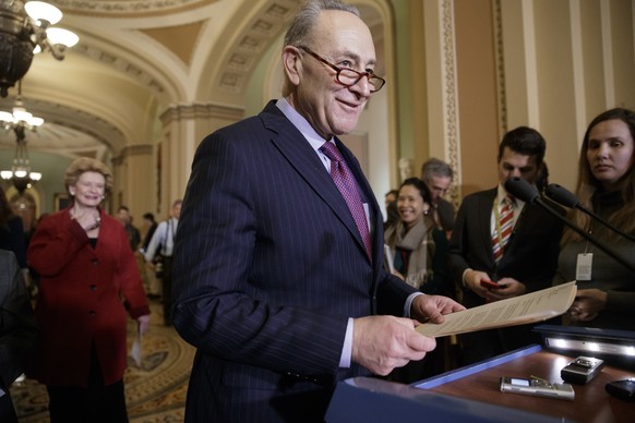 Senate Minority Leader Chuck Schumer, D-N.Y., followed by Sen. Debbie Stabenow, D-Mich., arrives for a news conference on Capitol Hill in Washington, Tuesday, Jan. 31, 2017. (AP Photo/J. Scott Applewh ...