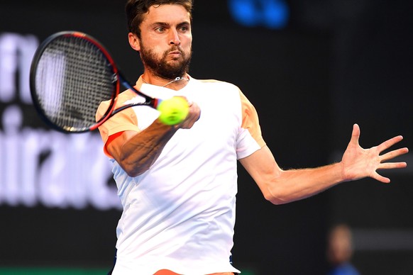 epa05737643 Gilles Simon of France in action against Milos Raonic of Canada during their Men&#039;s Singles third round match at the Australian Open Grand Slam tennis tournament in Melbourne, Victoria ...