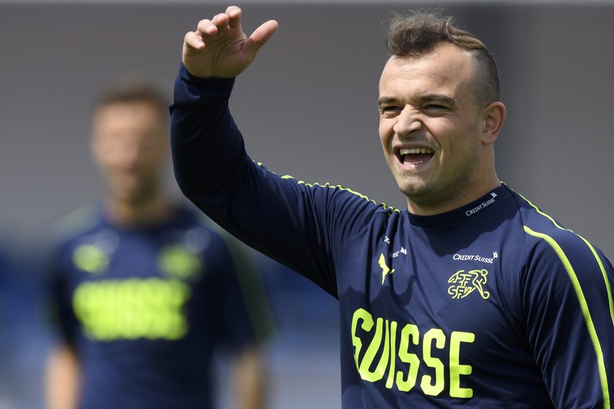 epa06803801 Switzerland&#039;s midfielder Xherdan Shaqiri smiles during a training session of the Swiss national soccer team at the Torpedo Stadium in Togliatti, Russia, 13 June 2018. The Swiss team i ...