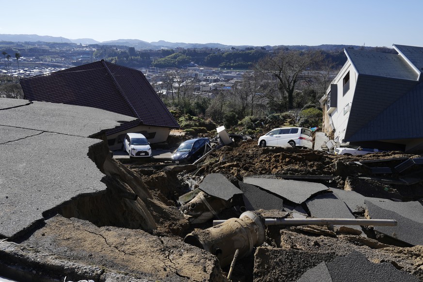 epa11052856 A view of a damaged road following a strong earthquake in Kanazawa, Ishikawa Prefecture, Japan, 02 January 2024. At least six people have died after a strong earthquake hit a wide area on  ...