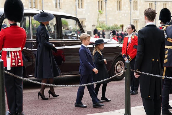 Kate, the Princess of Wales, Prince George and Princess Charlotte arrive for the Committal Service for Queen Elizabeth II held at St George's Chapel, in Windsor, England, Monday, Sept. 19, 2022. (Kirs ...