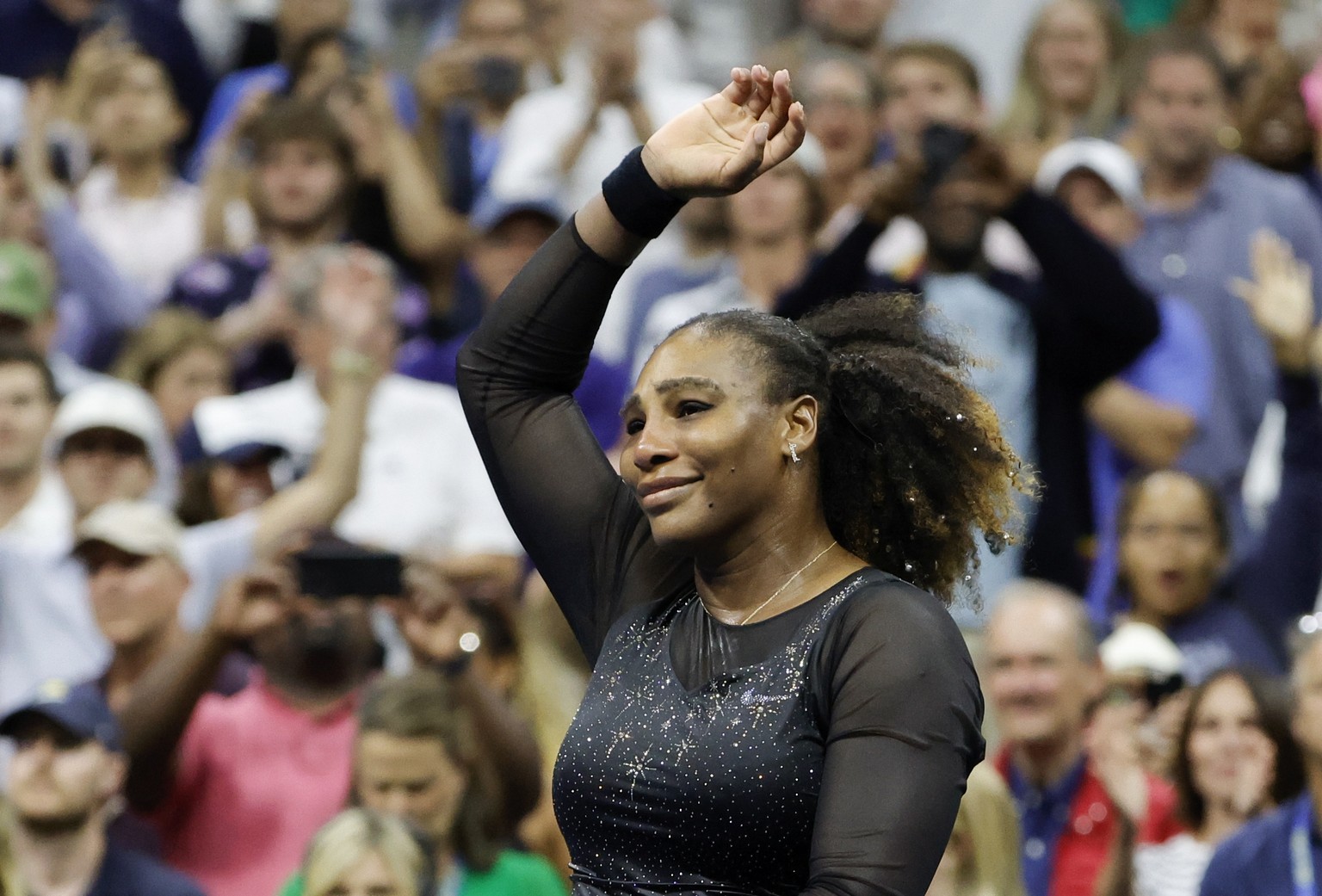epa10156292 Serena Williams of the United States waves to the crowd after being defeated by Ajla Tomljanovic of Australia, during the third round at the US Open Tennis Championships at the USTA Nation ...
