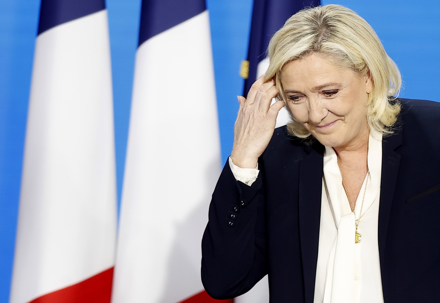 epa09907416 French presidential election candidate for the far-right Rassemblement National party candidate Marine Le Pen delivers a speech after being defeated in the second round of the French presi ...