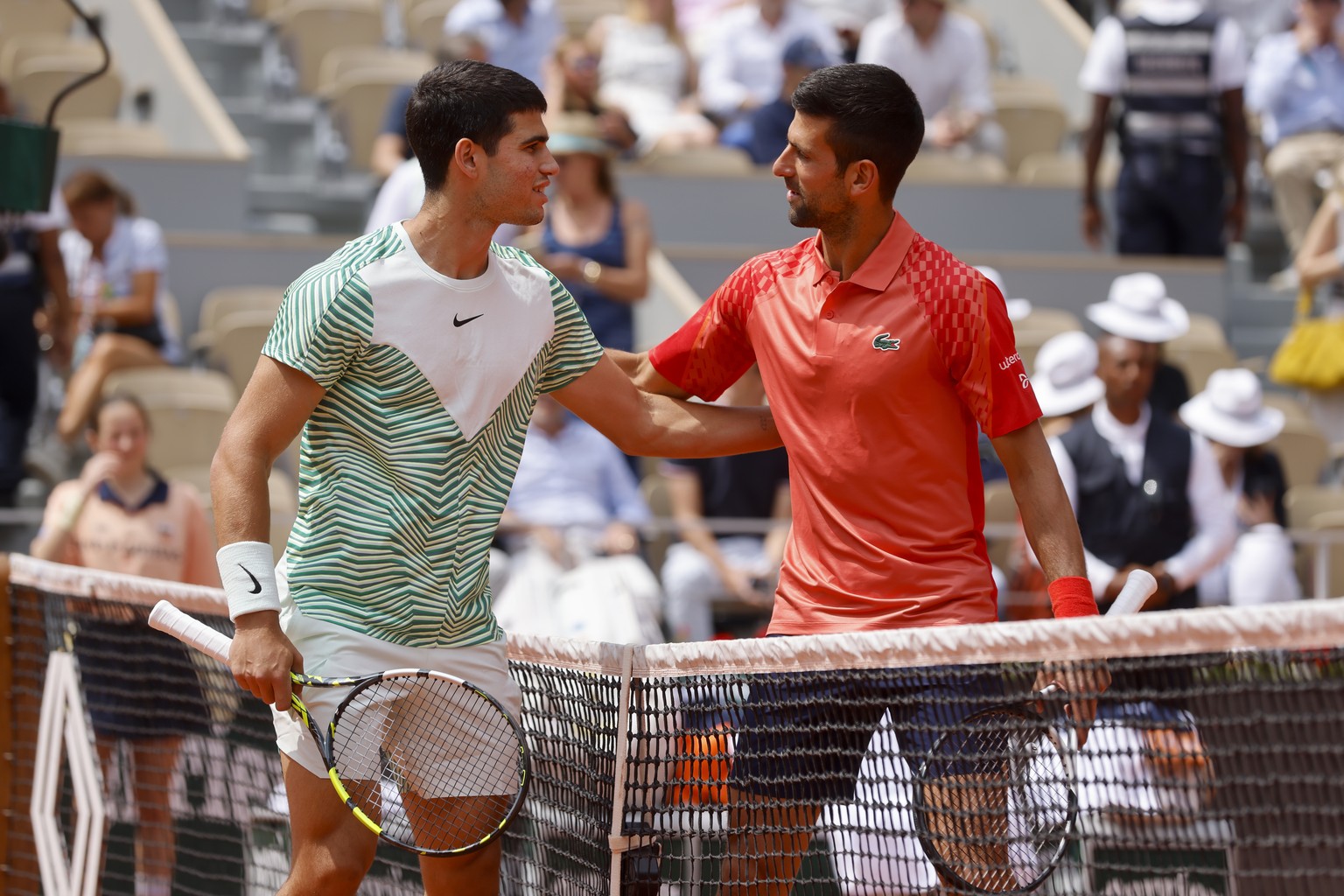 Spain&#039;s Carlos Alcaraz, left, and Serbia&#039;s Novak Djokovic greet each other ahead of their semifinal match of the French Open tennis tournament at the Roland Garros stadium in Paris, Friday,  ...