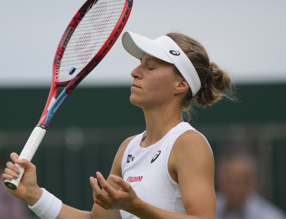 Switzerland's Viktorija Golubic gestures as she plays Barbora Krejcikova of the Czech Republic in a second round women's single match on day four of the Wimbledon tennis championships in Lon ...