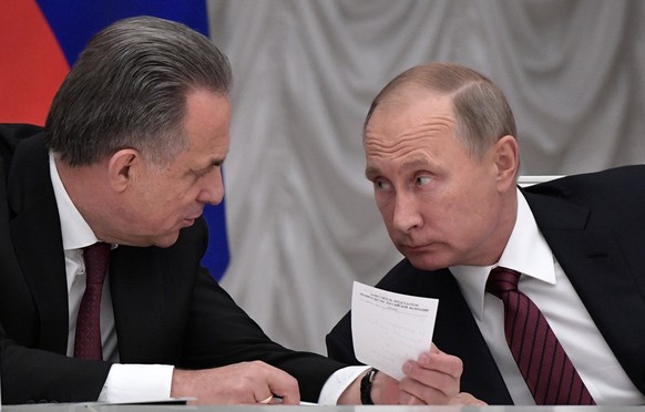 epa06242438 Russian President Vladimir Putin (R) and Russian Deputy Prime Minister Vitaly Mutko (L) attend a meeting of Presidential Council for the development of physical culture and sport in the Kr ...