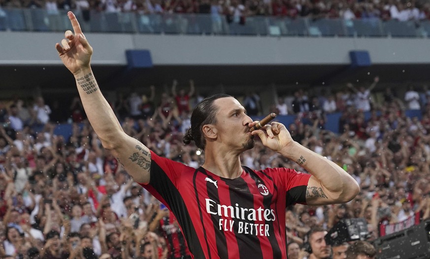 AC Milan&#039;s Zlatan Ibrahimovic puffs a cigar as he celebrates after winning a Serie A soccer match between AC Milan and Sassuolo, in Reggio Emilia&#039;s Mapei Stadium, Italy, Sunday, May 22, 2022 ...