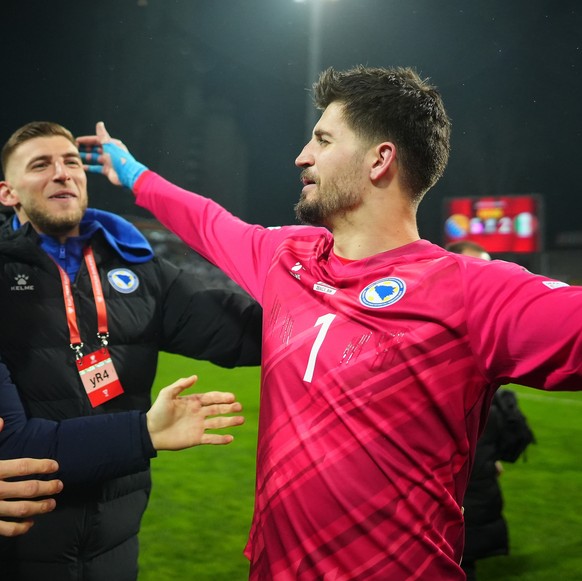 epa12863033 Goalkeeper Nikola Vasilj of Bosnia and Herzegovina celebrates after the team won the penalty shoout-out in the FIFA World Cup 2026 European playoff match between Bosnia and Herzegovina and ...