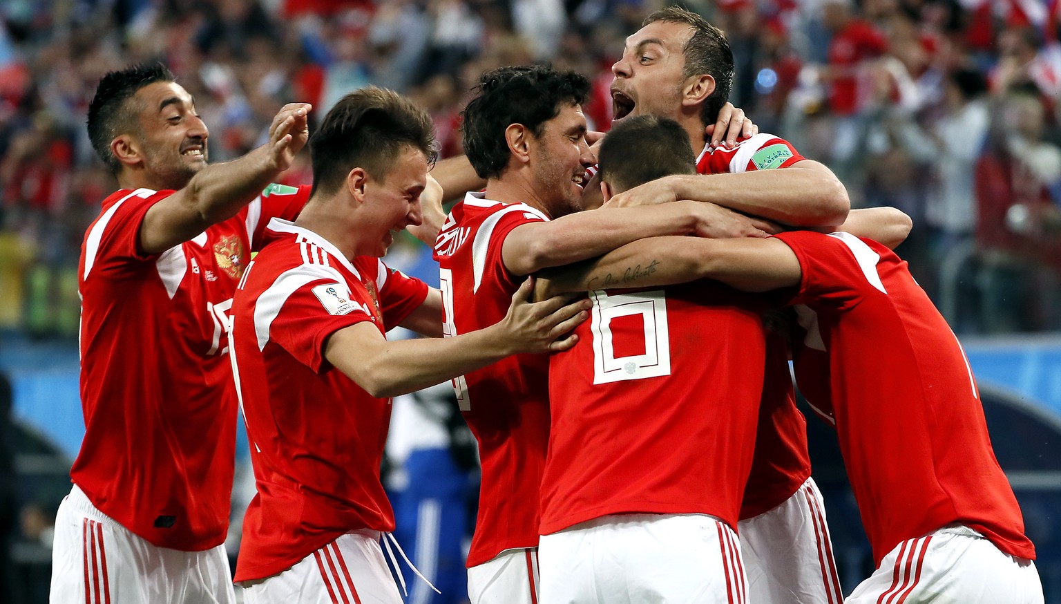 epa06822697 Players of Russia react after an own goal by Ahmed Fathi of Egypt the FIFA World Cup 2018 group A preliminary round soccer match between Russia and Egypt in St.Petersburg, Russia, 19 June  ...