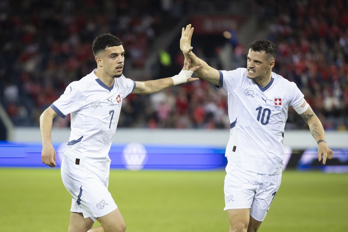 Switzerland's Zeki Amdouni, left, celebrates with teammate Granit Xhaka after scoring the 2-0 during an international friendly soccer match between Switzerland and Estonia at the Swissporarena in ...