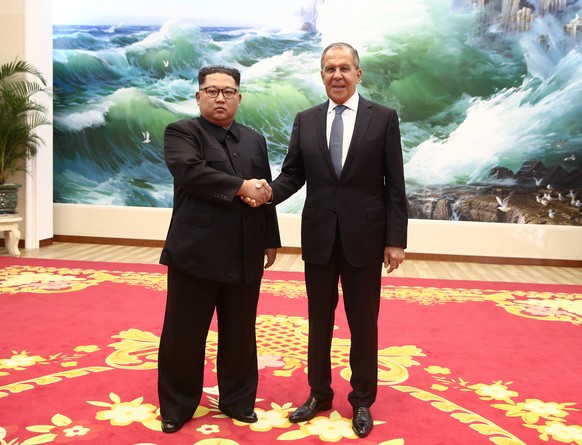 epa06775243 A handout photo taken from Russian Foreign Ministry&#039;s Flickr account shows Russian Foreign Minister Sergei Lavrov (R) shaking hands with President of North Korea Kim Jong-UN (L ) in P ...