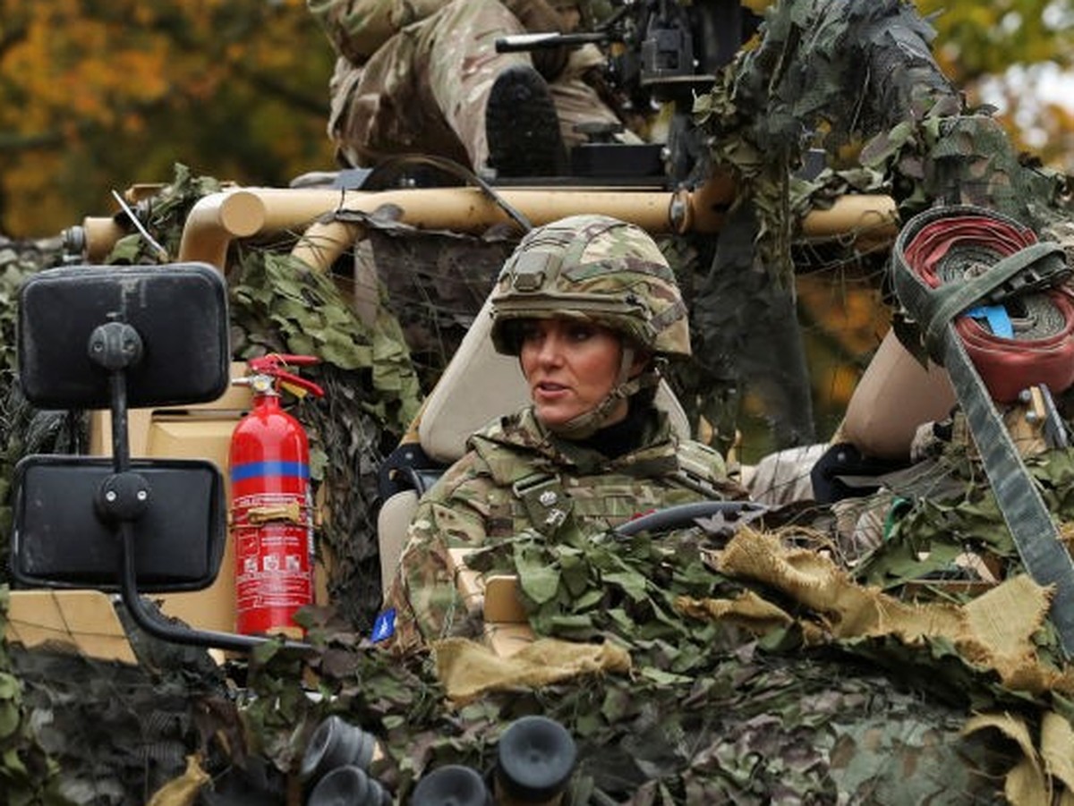 DEREHAM, ENGLAND - NOVEMBER 8: Catherine, Princess of Wales drives an armoured vehicle as she visits The Queen's Dragoon Guards Regiment for the first time as their Colonel in Chief on November 8 ...