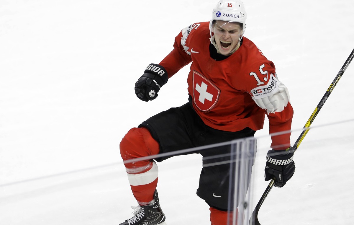 Switzerland's Gregory Hofmann celebrates after scoring his side's second goal during the Ice Hockey World Championships semifinal match between Canada and Switzerland at the Royal arena in H ...