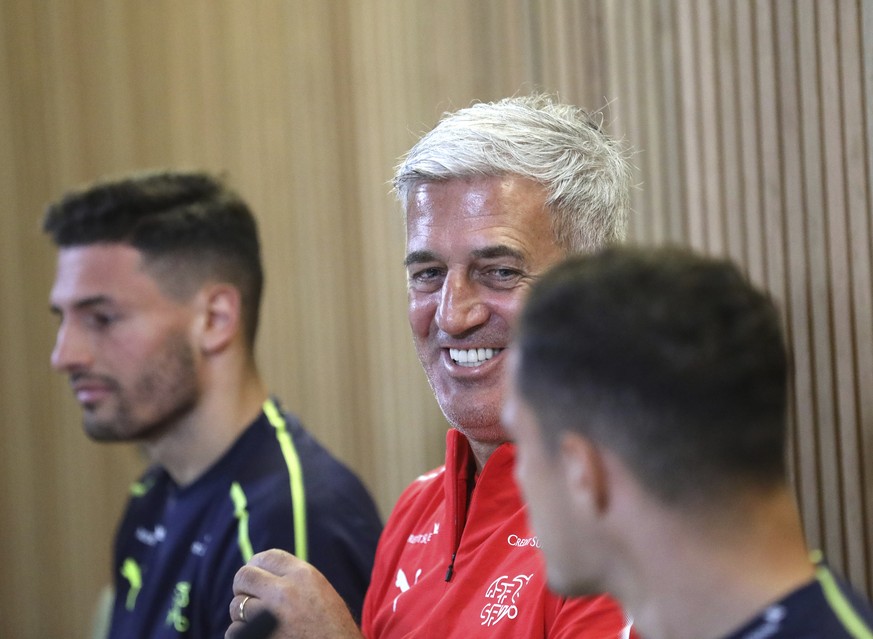 Switzerland soccer coach Vladimir Petkovic, centre, and players Fabian Schar, left, and Granit Xhaka attend a press conference at the Aviva stadium in Dublin, Ireland, Wednesday, Sept. 4, 2019. Switze ...