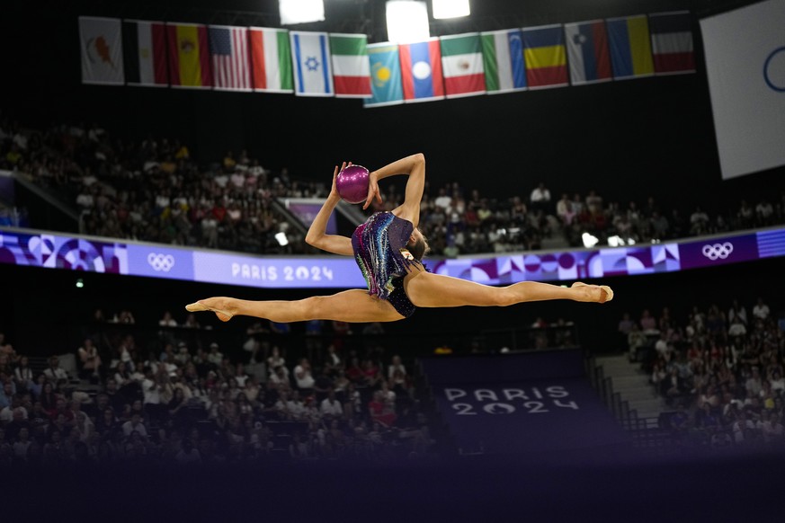 Vera Tugolukova, of Cyprus, performs her balls exercise in the rhythmic gymnastics individuals all-round qualification round at La Chapelle Arena at the 2024 Summer Olympics, Thursday, Aug. 8, 2024, i ...