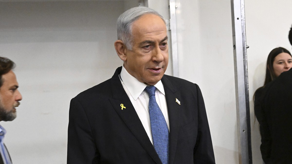Israeli Prime Minister Benjamin Netanyahu attends the fifth day of testimony in his trial on corruption charges at the district court in Tel Aviv, Israel, on Monday, Dec. 23, 2024. (Debbie Hill/Pool P ...