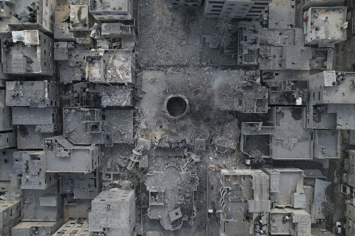The rubble of the Yassin Mosque, destroyed in an Israeli airstrike, is seen at Shati refugee camp in Gaza City early Monday, Oct. 9, 2023. Israel's military battled to drive Hamas fighters out of ...