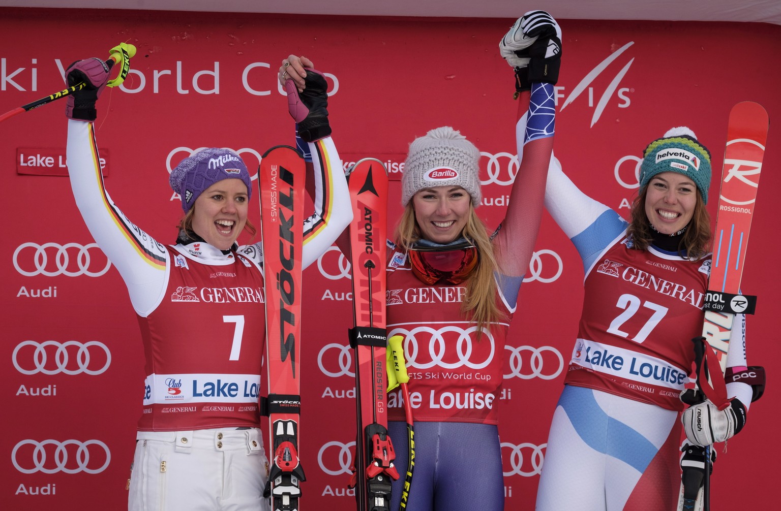 Mikaela Shiffrin, center, of the United States, celebrates her victory on the podium with second-place finisher Germany&#039;s Viktoria Rebensburg, left, and third-place finisher Switzerland&#039;s Mi ...