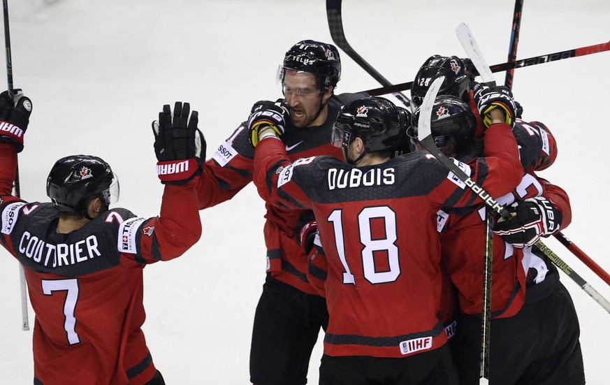 Canada players celebrate after scoring their second goal during the Ice Hockey World Championships quarterfinal match between Canada and Switzerland at the Steel Arena in Kosice, Slovakia, Thursday, M ...