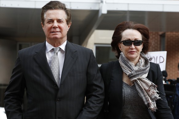 FILE - In this March 8, 2018, file photo, Paul Manafort, left, President Donald Trump&#039;s former campaign chairman, walks with this wife Kathleen Manafort, as they arrive at the Alexandria Federal  ...