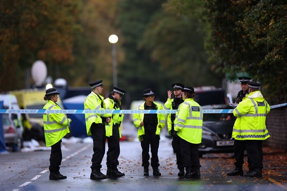 epa12426616 Police officers work at the scene of a fatal terror attack in Manchester, Britain, 03 October 2025. Two people died after a car and stabbing attack at a synagogue in Manchester on 02 Octob ...