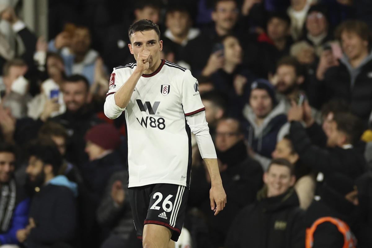 Fulham's Joao Palhinha celebrates after scoring the opening goal during the English FA Cup soccer match between Fulham and Leeds United at Craven Cottage in London, Tuesday, Feb. 28, 2023. (AP Ph ...