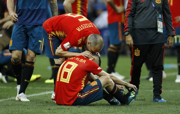 Spain&#039;s Andres Iniesta, above, comforts Spain&#039;s Jordi Alba at the end of the round of 16 match between Spain and Russia at the 2018 soccer World Cup at the Luzhniki Stadium in Moscow, Russia ...