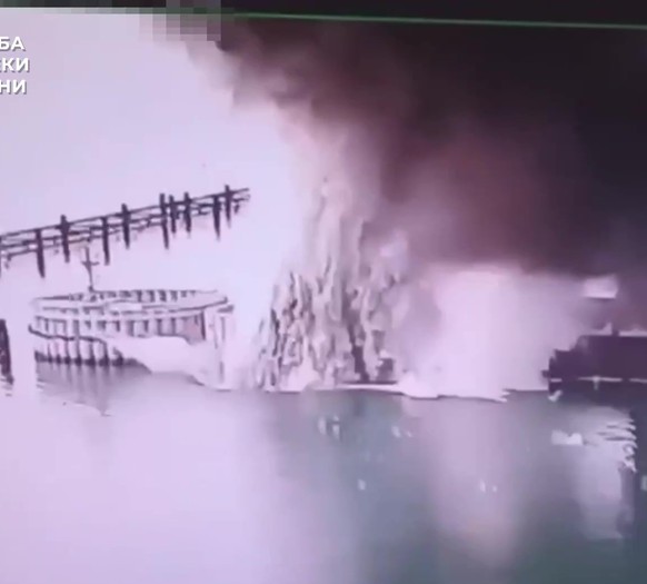 epa12152876 A still image grabbed from a handout video made available by the Ukrainian Security Service (SBU) on 03 June 2025 shows an explosion at the Crimea bridge. The SBU on 03 June 2025 said it h ...