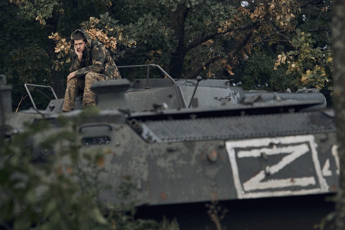 A Ukrainian soldier sits atop a Russian armoured personnel carrier in Izium, Kharkiv region, Ukraine, Tuesday, Sept. 13, 2022. Ukrainian troops piled pressure on retreating Russian forces Tuesday, pre ...