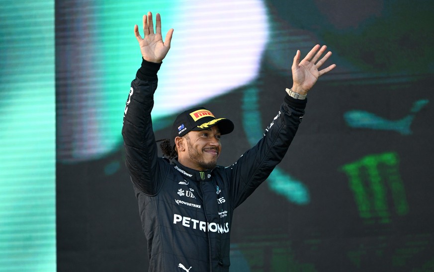 epa10555034 Mercedes driver Lewis Hamilton of Great Britain reacts on the podium after placing 2nd in the 2023 Formula One Grand Prix of Australia at the Albert Park Circuit in Melbourne, Australia, 0 ...