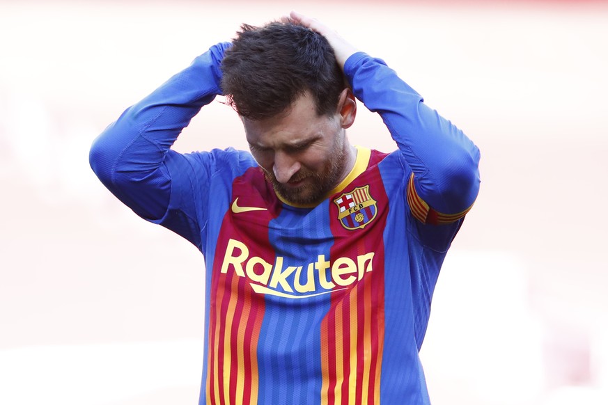 Barcelona&#039;s Lionel Messi reacts after a missed scoring opportunity during the Spanish La Liga soccer match between FC Barcelona and Atletico Madrid at the Camp Nou stadium in Barcelona, Spain, Sa ...