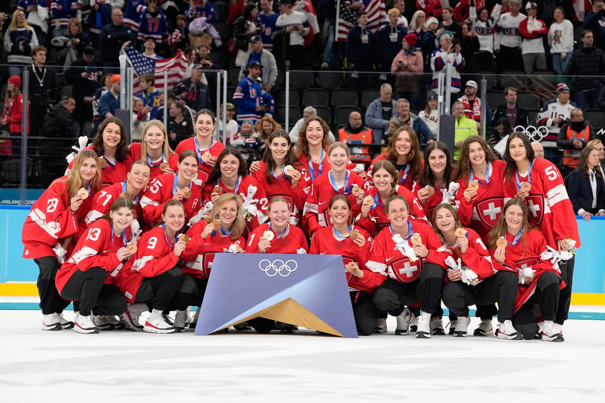 Switzerland players pose after victory ceremony for women's ice hockey at the 2026 Winter Olympics, in Milan, Italy, Thursday, Feb. 19, 2026. (AP Photo/Hassan Ammar)
Milan Cortina Olympics Ice Ho ...