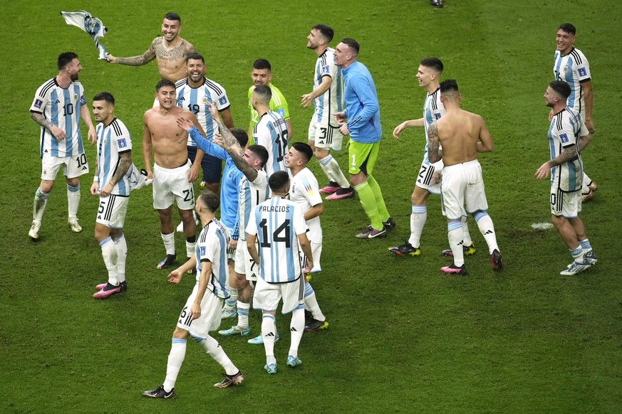 Argentina&#039;s players celebrate their victory at the end of the World Cup final soccer match between Argentina and France at the Lusail Stadium in Lusail, Qatar, Sunday, Dec. 18, 2022. (AP Photo/Ch ...