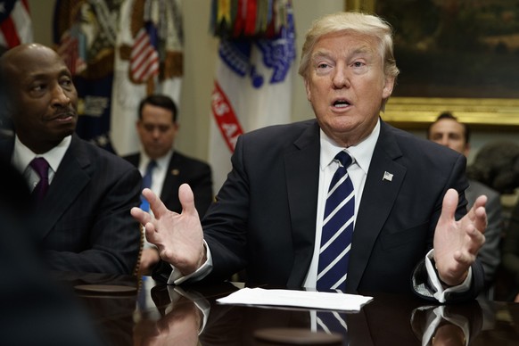Merck CEO Kenneth Frazier listens at left as President Donald Trump speaks during a meeting with pharmaceutical industry leaders in the Roosevelt Room of the White House in Washington, Tuesday, Jan. 3 ...