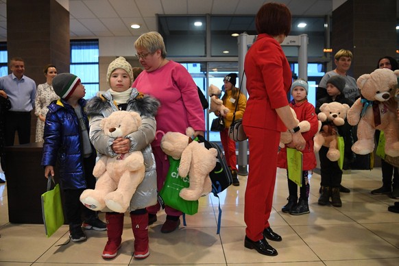 Russia Ukraine Military Operation Orphans 8294193 13.10.2022 Children hold toys during an event to meet orphan children from the Russia s Luhansk People s Republic and transfer them to foster parents  ...