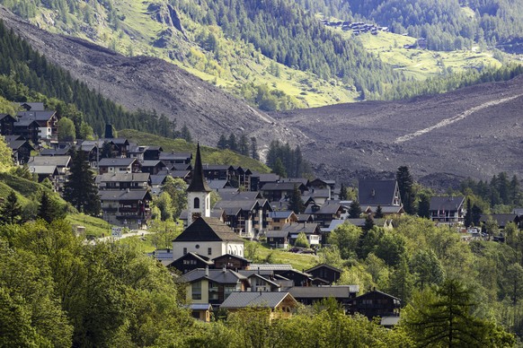 A massive debris avalanche, with the village of Kippel in the foreground, is seen on Thursday, May 29, 2025, one day after the collapse of the Birch Glacier causing the demolishing of the village of B ...
