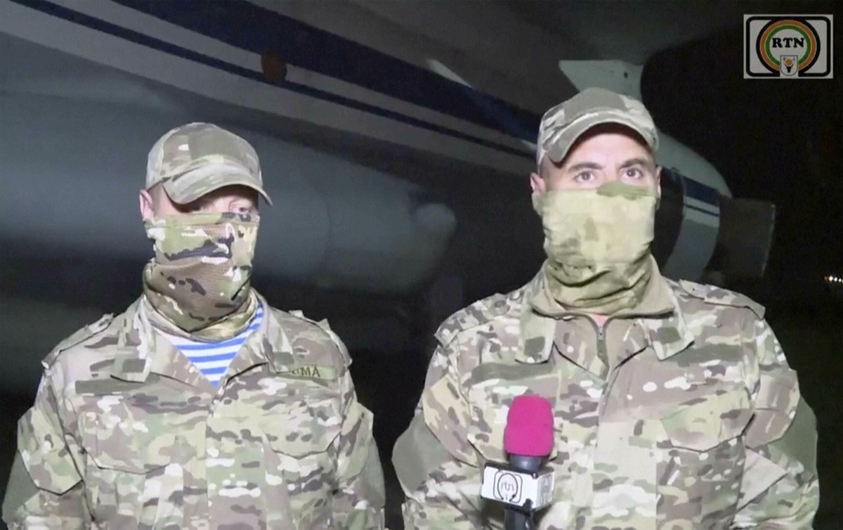 In this image taken from video from RTN, Unidentified Russian military instructors speak to media on their arrival in Niamey, Niger, April 10, 2024. Niger's state television is reporting that one ...