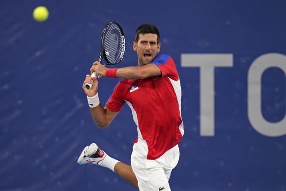 Novak Djokovic, of Serbia, plays Kei Nishikori, of Japan, during the quarterfinals of the tennis competition at the 2020 Summer Olympics, Thursday, July 29, 2021, in Tokyo, Japan. (AP Photo/Seth Wenig ...